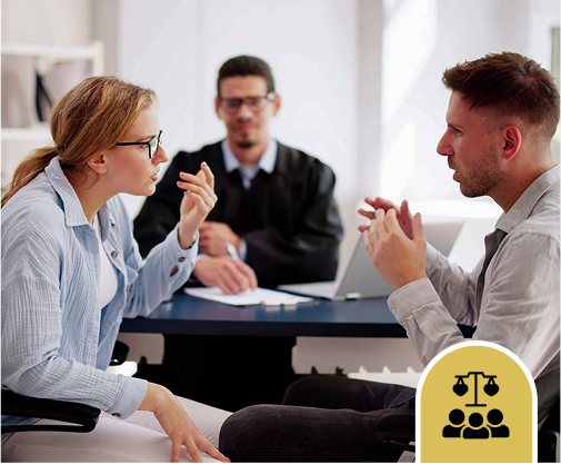 A man and woman sit across from each other in a heated discussion, with a judge present at a desk, suggesting a legal or mediation setting. A justice icon appears in the foreground.